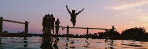 Person jumping into the lake