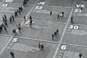 Overhead view of people walking in a city square