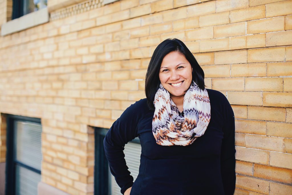 Sheryle Gillihan in a black shirt and a scarf.