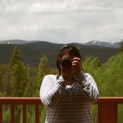 Sheryle taking a picture of the mountains
